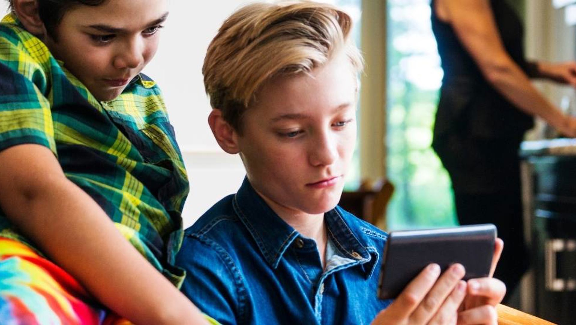 Children watching mobile phone